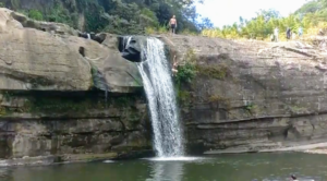 Girl jumping from the lingjiao waterfall