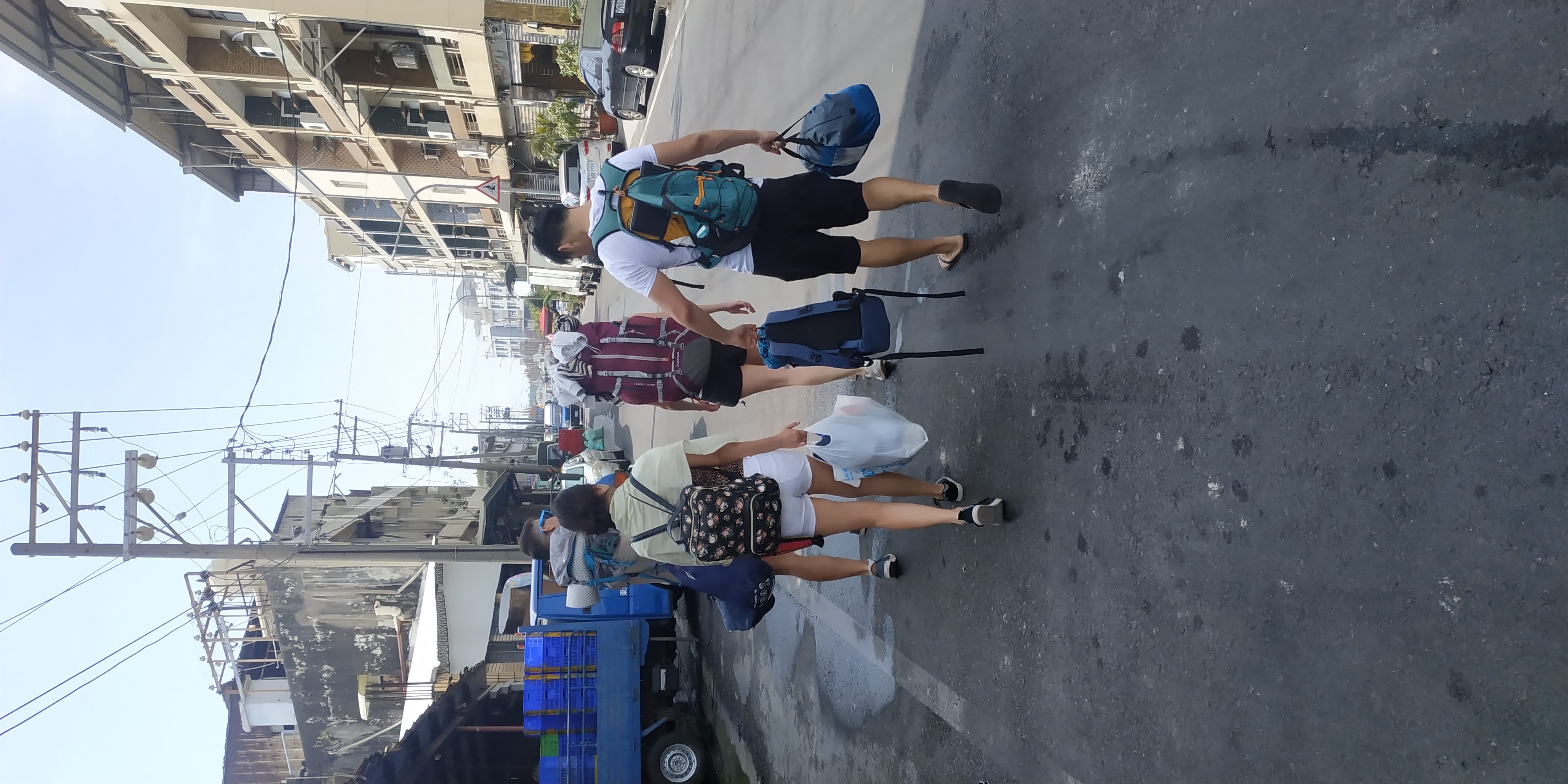 4 people walking in the street